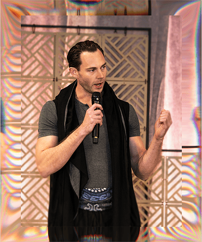 Entrepreneur speaking confidently at the Welcome event, engaging the audience with insights on busin.